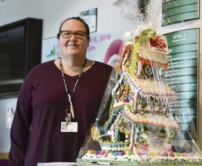 Local nurse dedicates 3 weeks to make a 3-story gingerbread house for Victoria Hospital campaign