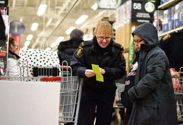 Shop with a Cop leaves 25 deserving children with full carts and full hearts