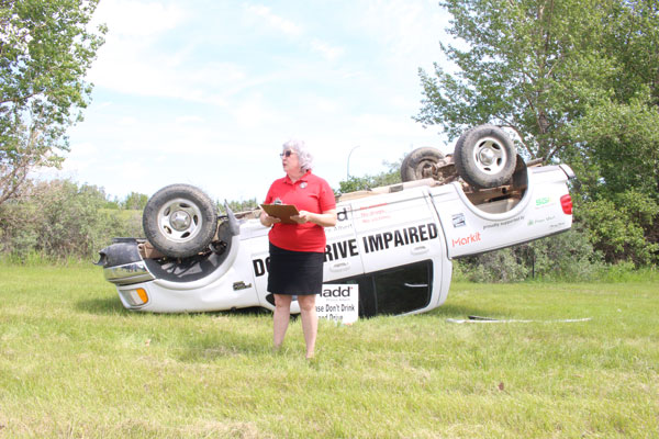 Smashed car display offers reminder about risks of impaired driving