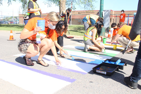 Queen Mary students paint crosswalk for Pride Month