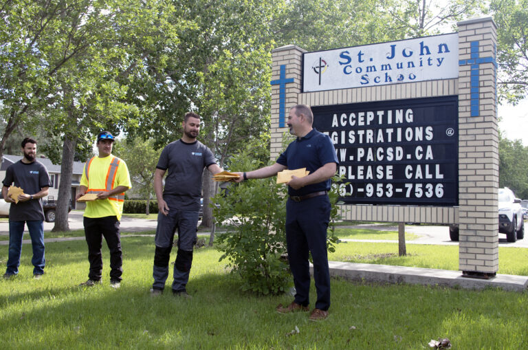 Locally-owned business donates Kinsmen Water Park passes to students at St. John Community School