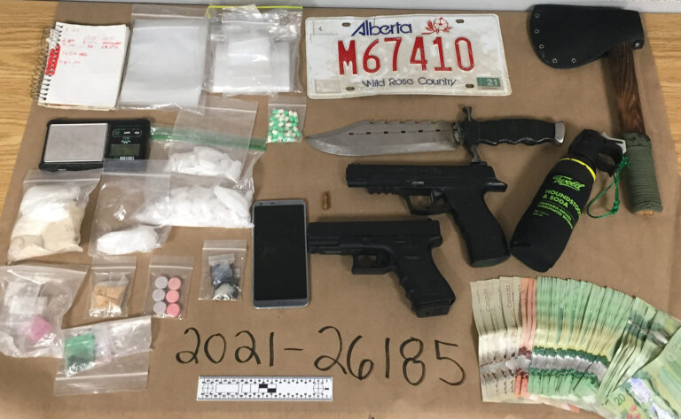 Routine vehicle stop leads to weapons, drugs and cash seizure