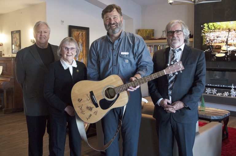 Autographed guitar makes its way home to Rose Garden Hospice