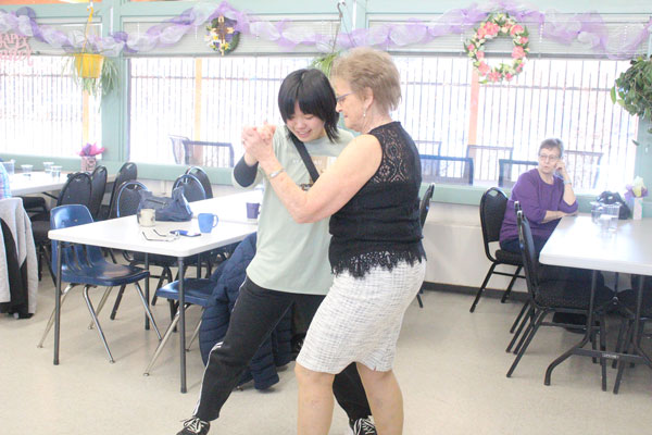 Japanese visitors getting full Canadian experience with dancing and curling